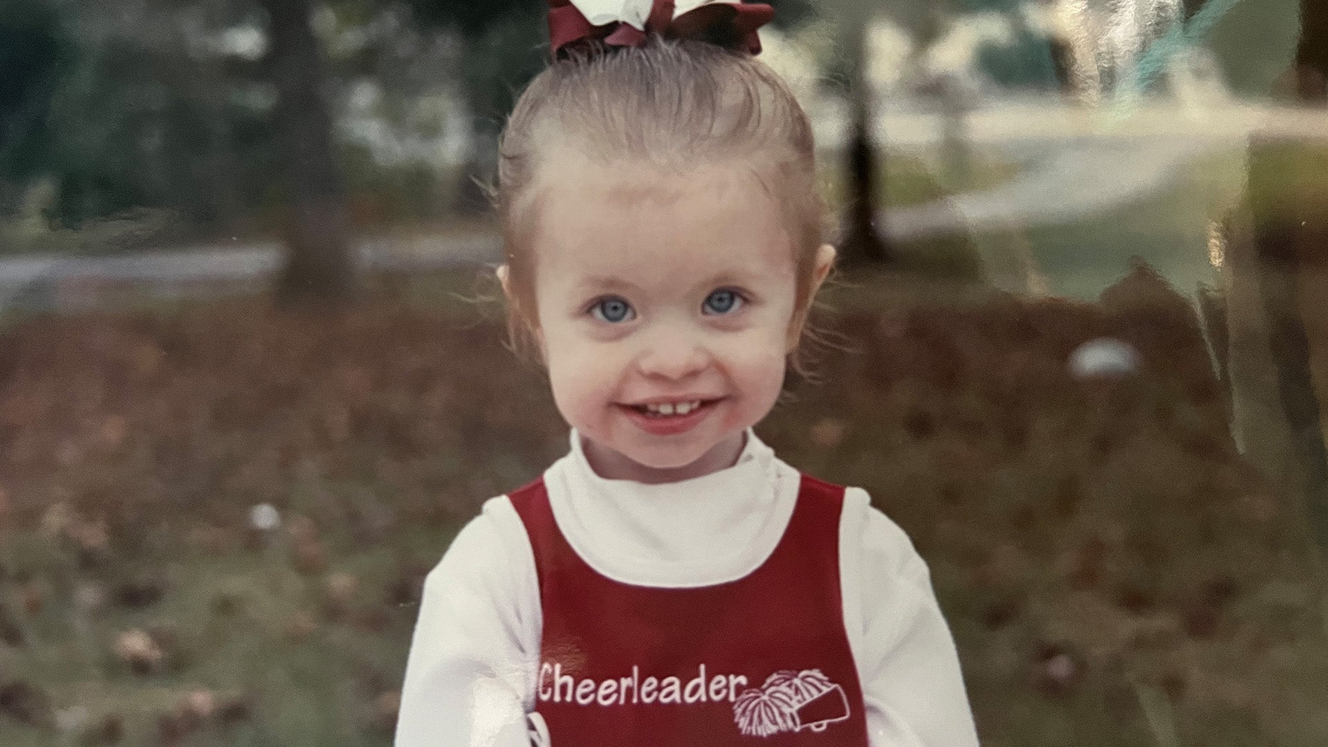 Anna Grace in a cheer outfit when she was a child