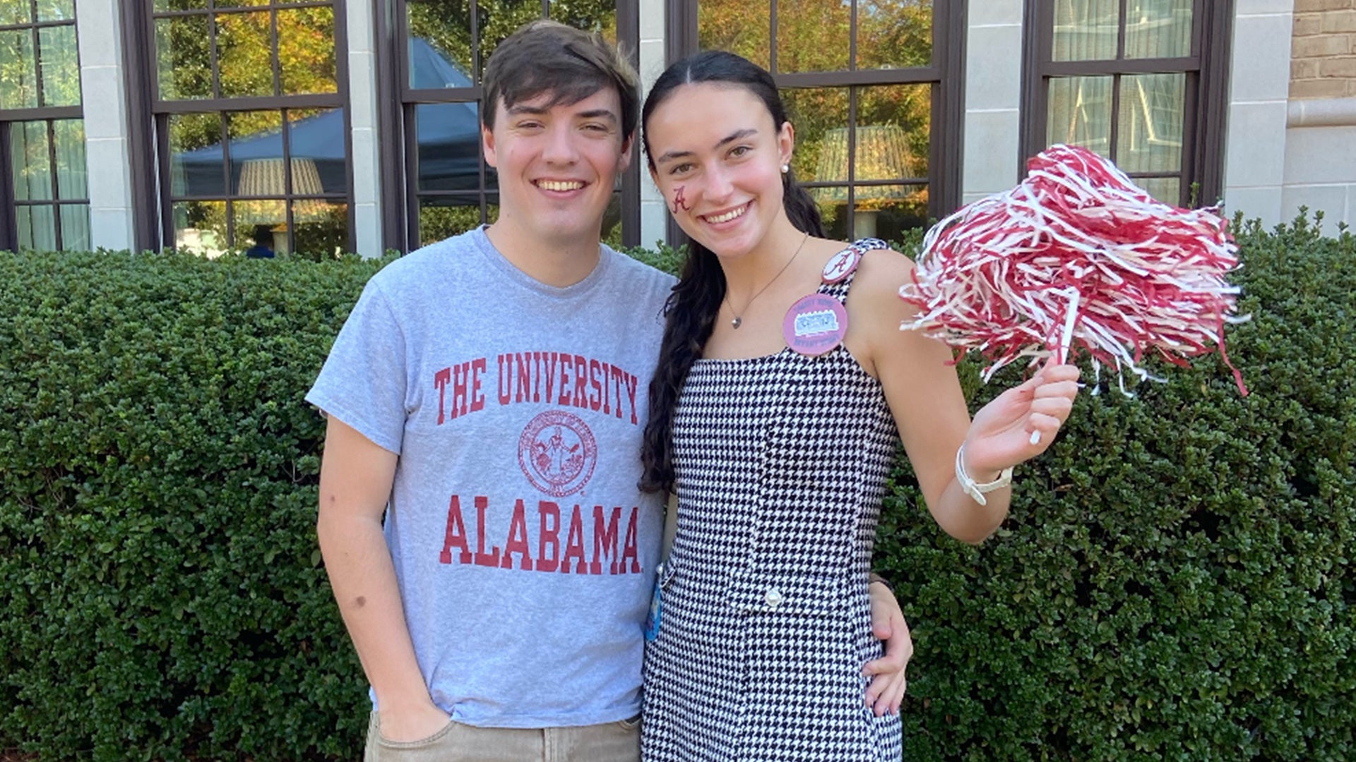 Price and a female friend getting ready for gameday.