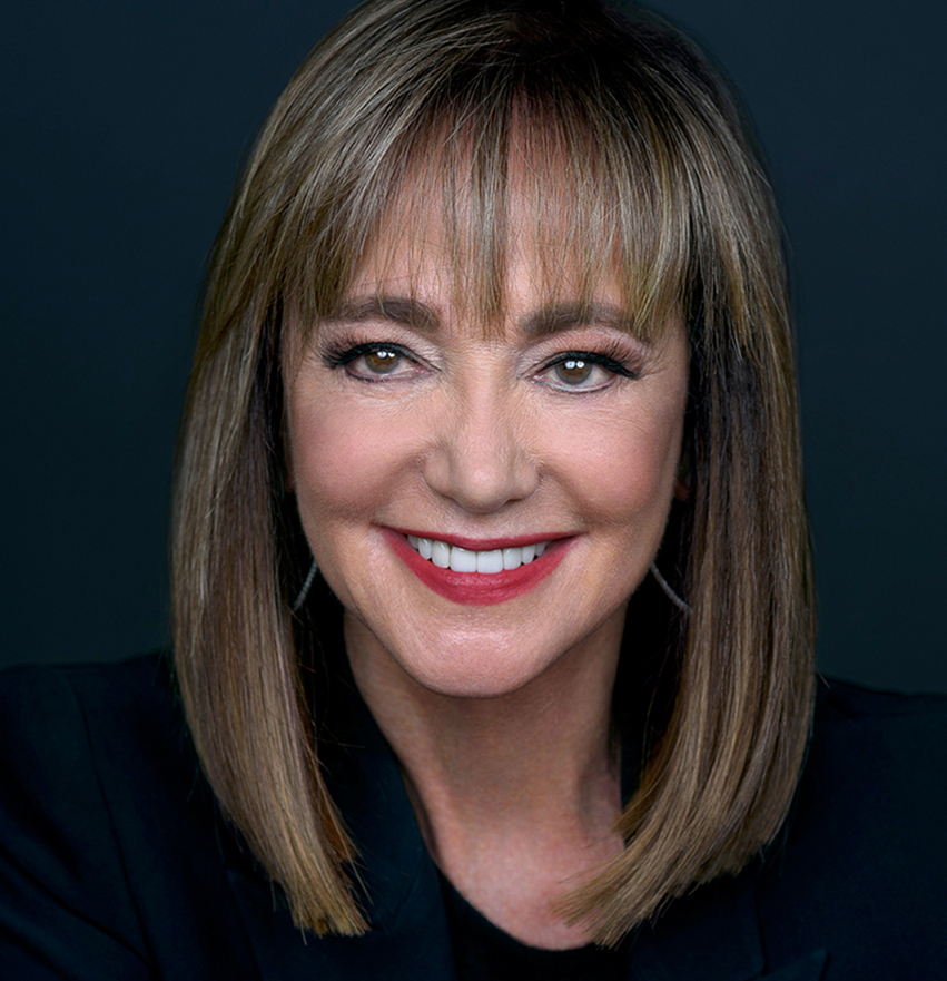 Portrait of Janet Gurwitch against a dark teal background